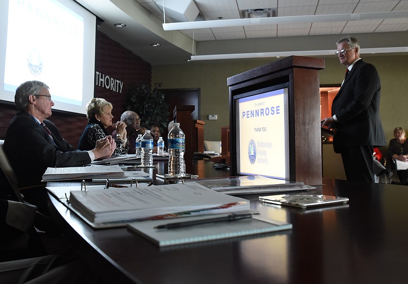 Mark Straub, right, development officer for PENNROSE, presents his proposal for a new development on Chattanooga Housing Authority property to the CHA board at a Tuesday meeting.