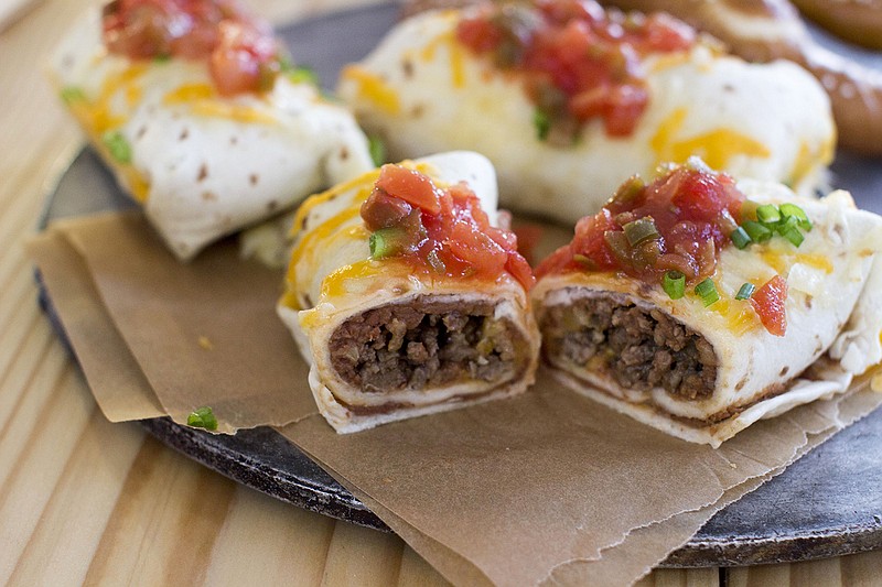 Prep-ahead mini bean and beef burritos can be great finger food at a Super Bowl party.