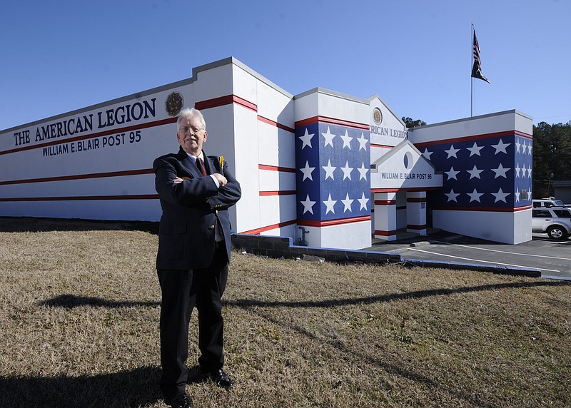 Post 95 Commander Joe Pratt stands in front of the newly painted exterior of the American Legion Post 95 in East Ridge.