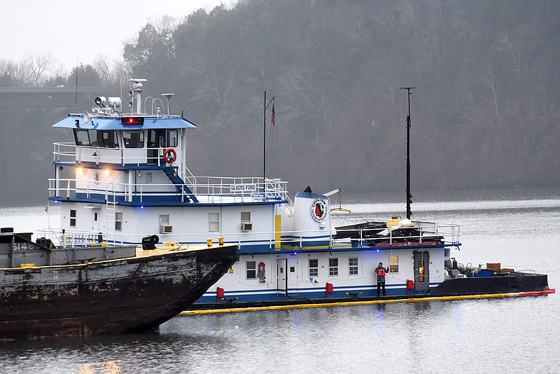 The Gladys Ford towboat, owned by Choctaw Transportation Co., is being attended to by Marion Environmental, Inc. on the Tennessee River in Marion County. 