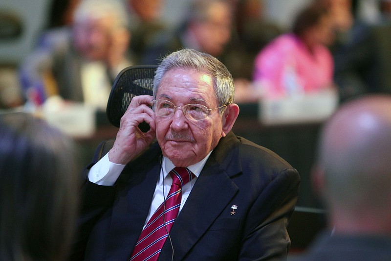 
              CORRECTS CITY TO SAN ANTONIO DE BELEN - In this publicly distributed handout photo provided by the Presidency of the Republic of Costa Rica, Cuba's President Raul Castro listens on a headphone during the summit of the Community of Latin American and Caribbean States in San Antonio de Belen, Costa Rica, Wednesday, Jan. 28, 2015. Castro demanded that the United States return the U.S. base at Guantanamo Bay, lift the half-century trade embargo on Cuba and compensate his country for damages before the two nations re-establish normal relations. (AP Photo/Presidency of the Republic of Costa Rica, Roberto Carlos Sanchez)
            