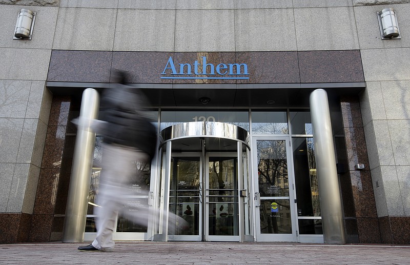 
              FILE - In this Dec. 3, 2014 file photo, a pedestrian walks past the corporate headquarters of health insurer Anthem, in Indianapolis. Anthem reports quarterly financial results on Wednesday, Jan. 28, 2015. (AP Photo/Darron Cummings, File)
            