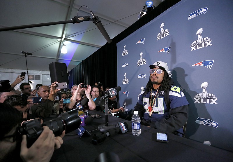 
              Seattle Seahawks' Marshawn Lynch attends a news conference for NFL Super Bowl XLIX football game, Wednesday, Jan. 28, 2015, in Phoenix. The Seahawks play the New England Patriots in Super Bowl XLIX on Sunday, Feb. 1, 2015. (AP Photo/Matt York)
            