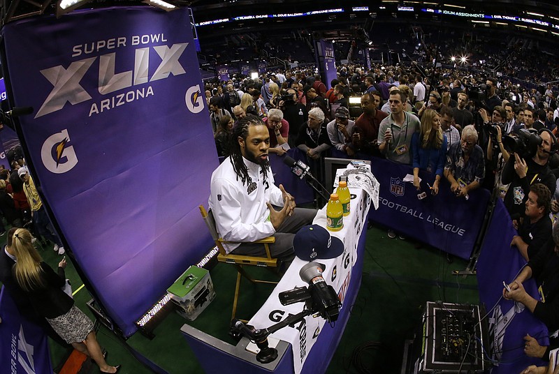 
              Seattle Seahawks' Richard Sherman answers questions during media day for NFL Super Bowl XLIX football game Tuesday, Jan. 27, 2015, in Phoenix. (AP Photo/Charlie Riedel)
            