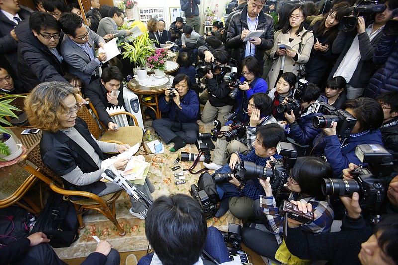 Junko Ishido, left, the mother of Japanese journalist Kenji Goto who is being held hostage by the Islamic State group, speaks during a press conference at her home in Koganei on the outskirts of Tokyo late on Jan. 28, 2015. 