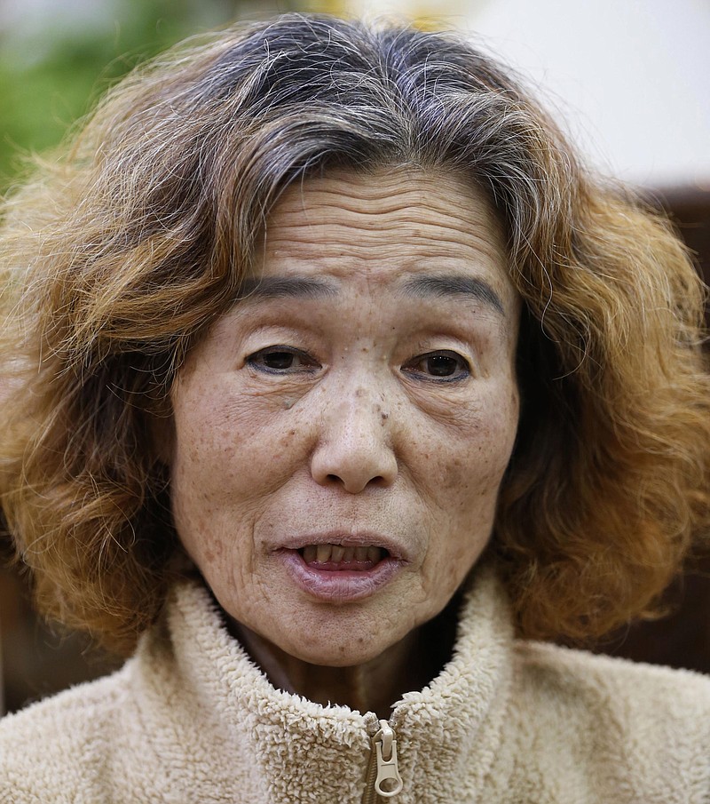 Junko Ishido, the mother of Japanese hostage Kenji Goto held by the Islamic State group, speaks to the media in Koganei on the outskirts of Tokyo Wednesday, Jan. 28, 2015, shortly after the latest online message purportedly from the group warmed that Goto and a Jordanian pilot the extremists hold have less than "24 hours left to live."