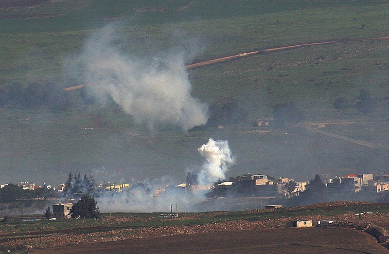 Smoke rises from Israeli shelling in the edge of the Lebanese village of Abbasieh, at the Lebanese-Israeli border, south Lebanon, Wednesday, Jan. 28, 2015. 