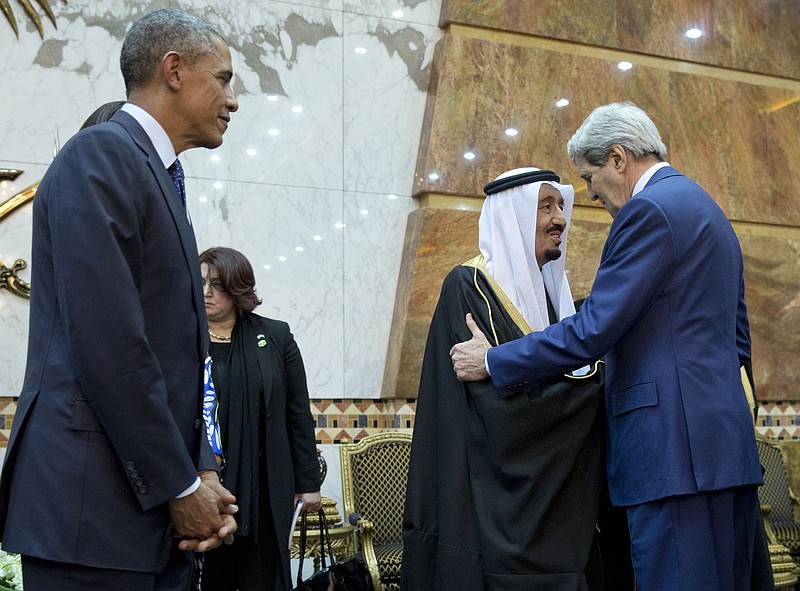 President Barack Obama stands at left as Secretary of State John Kerry, right, greets new Saudi Arabian King, Salman bin Abdul Aziz in Riyadh, Saudi Arabia, Tuesday, Jan. 27, 2015. 