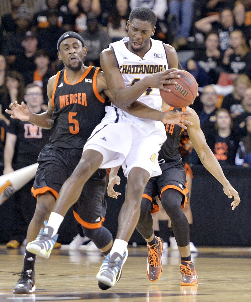 Mercer guard Jestin Lewis (5) and UTC 's Casey Jones (24) while going after a loose ball during their game Thursday Jan. 29, 2015. (Macon THE TELEGRAPH by JASON VORHEES) 