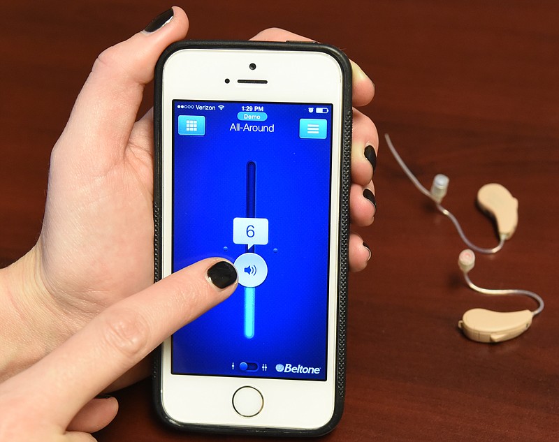 Beltone's new hearing aid, the First, can be controlled through an iPhone app, can stream music from Apple devices,
smartphones and tablets, and can be used as a microphone and recorder, enabling it to be used as an
audio teleprompter. Android compatible hearing aids should be available in February.