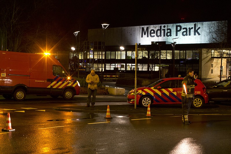 
              Security forces are seen outside the Media Park in Hilversum, Netherlands, Thursday, Jan. 29, 2015. A gunman entered the headquarters of Dutch national broadcaster NOS outside Amsterdam on Thursday and demanded airtime on television, before being detained, company officials said. Jan de Jong, director of the NOS, told national radio "Someone got into the building" and added that the man had been taken into custody.(AP Photo/Peter Dejong)
            
