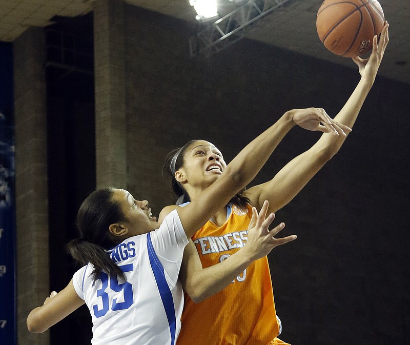 Tennessee's Isabelle Harrison, right, shoots under the defense of Kentucky's Alexis Jennings, left, during their game in Lexington, Ky., Thursday, Jan. 29, 2015. 