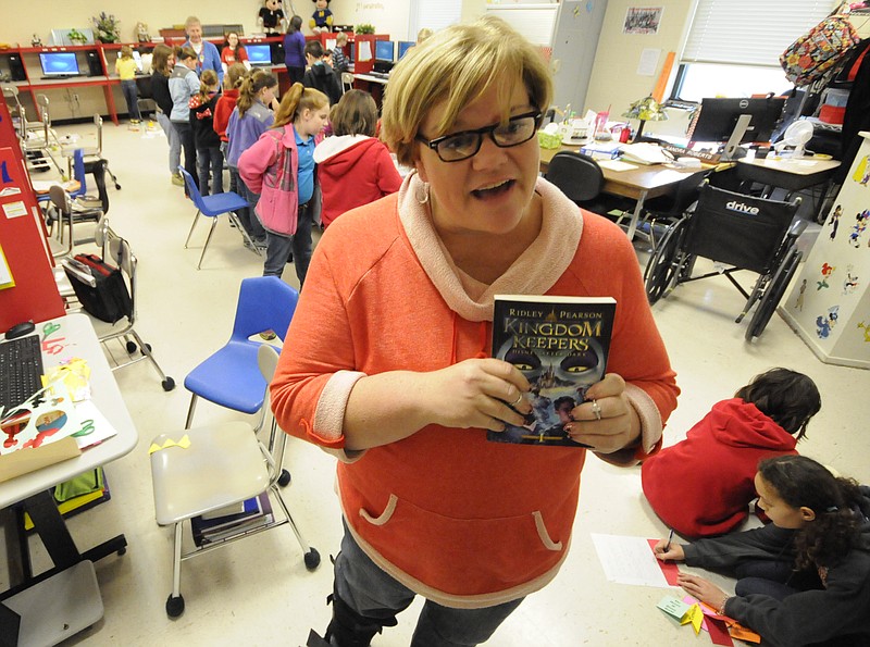 Whitwell Middle School teacher Sandy Roberts talks about the Disney project in her Tier I TRI class Friday. Roberts will take several students to Disney World in May to research one of the park's roller coasters and its G-forces.