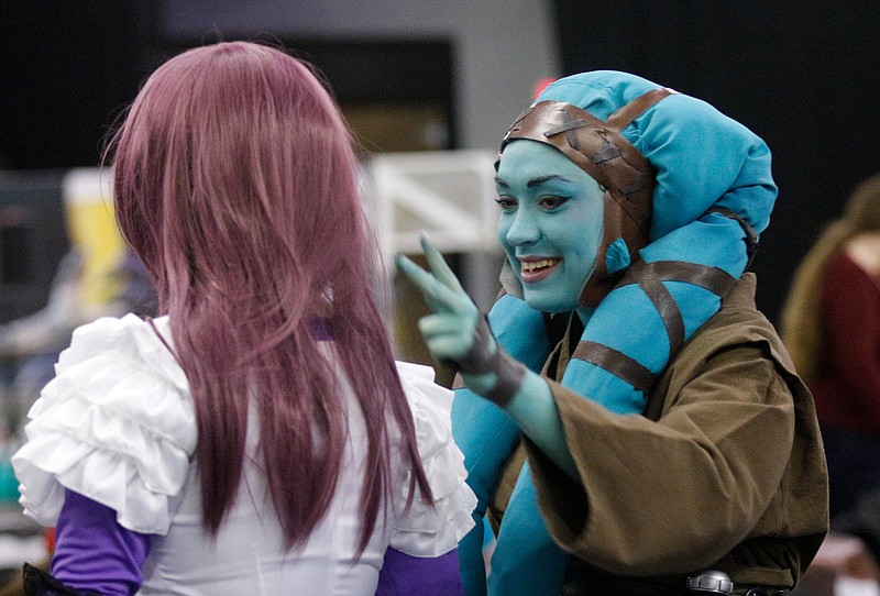 Bethany Thomasson, right, dressed a twi'lek alien species from Star Wars, fixes the hair of Rebecca Rasnick on Saturday, Jan. 31, 2015, at the annual ChattaCon convention at the Chattanooga Choo Choo in Chattanooga.