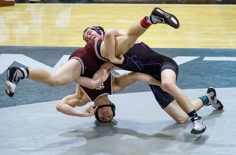 Gilmer's Will Gudger, right, wrestles Southeast Whitfield's Tyler Brown in their 145 lb championship bout of the Area 7-AAAA traditional wrestling tournament on Saturday, Jan. 31, 2015, at Ridgeland High School in Rossville, Ga.