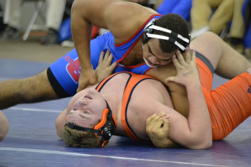 Cleveland heavyweight Koran Kennedy controls Summit's Hunter Hancock on the way to a 15-0 technical fall in the state duals tournament Friday, Jan. 30, 2015. (Photo contributed by Duustin Coleman)