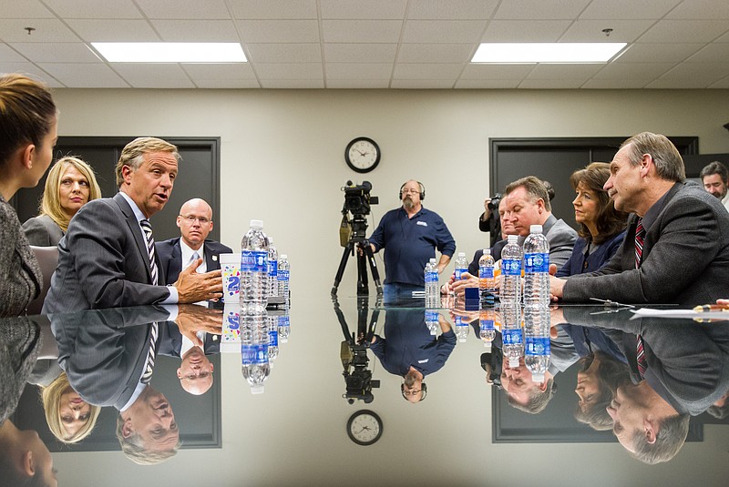 
              Gov. Bill Haslam, left, speaks with lawmakers in Murfreesboro, Tenn., on Thursday, Jan. 29, 2015, about his proposal to extend health coverage to 280,000 low-income Tennesseans. A special session to take up the matter is scheduled to begin on Monday. (AP Photo/Erik Schelzig)
            