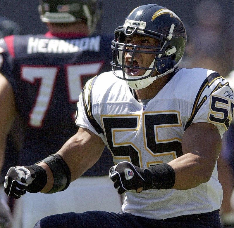 San Diego Chargers' Junior Seau does a celebration dance after one of his seven tackles in the Chargers' 24-3 win over the Houston Texans in this 2002, file photo.