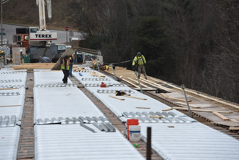 Workers prepare a new, wider floor for the bridge over Interstate 24, at Missionary Ridge on Jan. 26, 2015. The work is being done on the northern half of the ridge cut bridge that passes over Main Street.