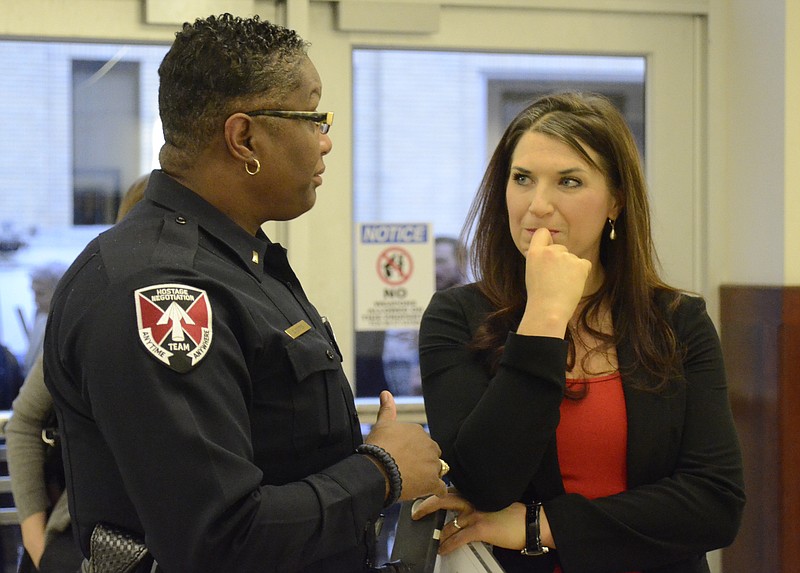 Lt. Corliss Cooper, left, speaks with Kat Cooper in this 2013 file photo.