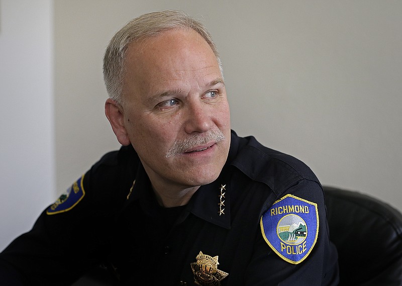 
              In this Thursday, Jan. 29, 2015 photo, Richmond Police Chief Chris Magnus poses for a photo, in Richmond, Calif. Last month the openly gay, white police chief of this tough, minority-dominated Northern California city held up a sign reading “#blacklivesmatter” during a demonstration protesting the deaths of two unarmed black suspects at the hands of Missouri and New York police. The photo of Magnus holding the sign went viral, sparking criticism from the local police officers’ union and debate over whether his participation was appropriate. (AP Photo/Ben Margot)
            