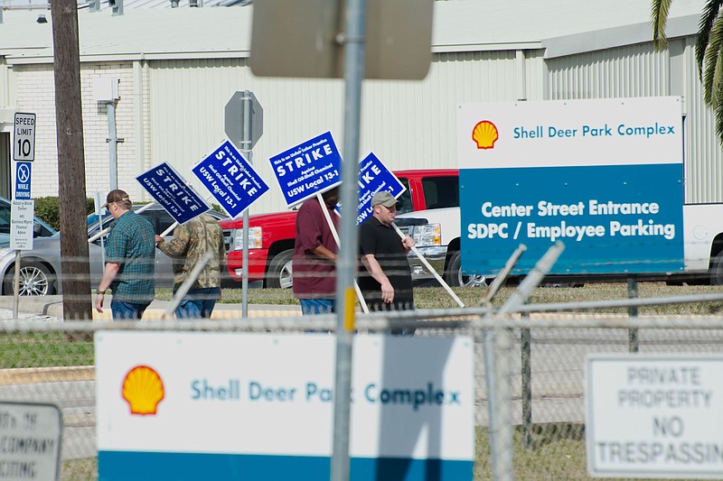 
              Representatives from Deer Park United Steelworkers Local 13-1 hold picket signs outside the Shell Deer Park Refinery as the Union calls for strikes against the Shell refinery and chemical plants in Deer Park, Texas, Sunday, Feb. 1, 2015. (AP Photo/The Courier, Kirk Sides)
            