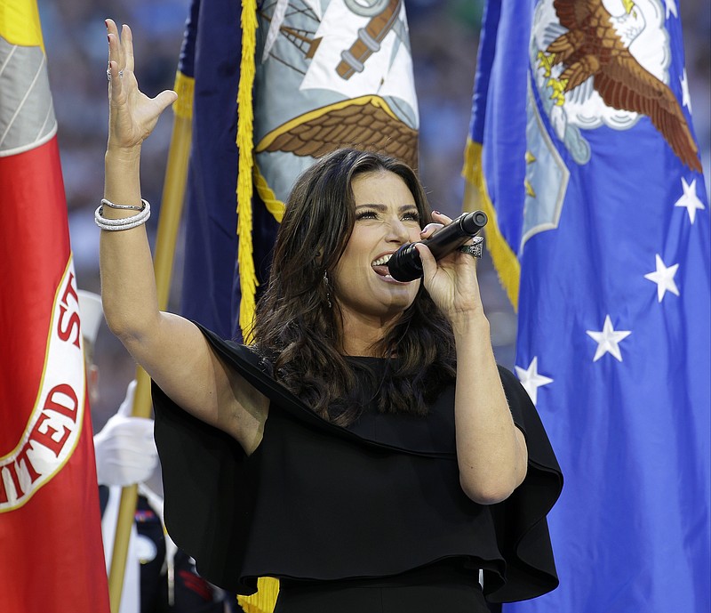 Idina Menzel sings the national anthem before the NFL Super Bowl XLIX between the Seattle Seahawks and the New England Patriots on Sunday, Feb. 1, 2015, in Glendale, Ariz. 