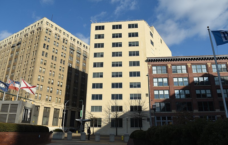 The Edney Building, center, located at the corner of Market and 11th Streets, is photographed on Monday, Feb. 2, 2015, in downtown Chattanooga, Tenn. Seen at left is Patten Towers, while Warehouse Row is at right. 