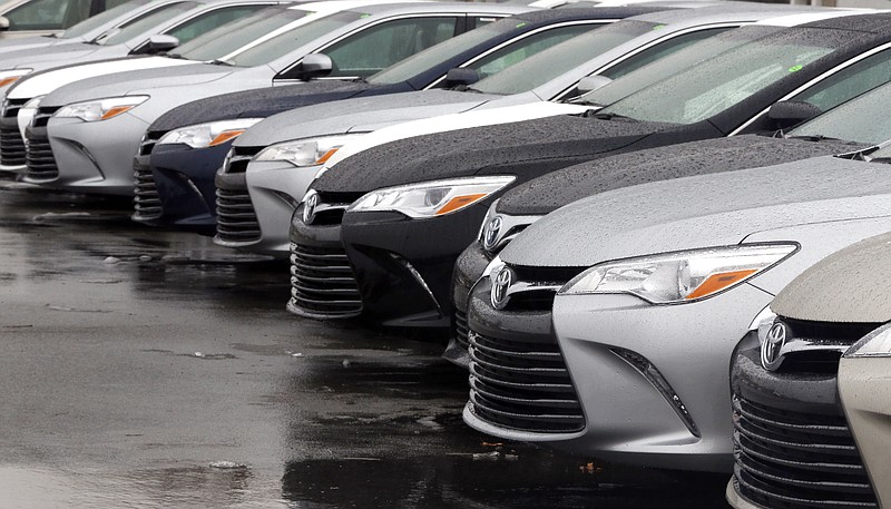 
              In this Monday, Jan. 12, 2015 photo, Toyota cars for sale are parked at a dealership in Danvers, Mass. Automakers report sales for the month of January, on Tuesday, Feb. 3, 2015. (AP Photo/Elise Amendola)
            