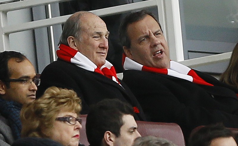 
              New Jersey Gov. Chris Christie, right, wearing an Arsenal scarf, sits with Rutgers University President Robert Barchi in the stands during the English Premier League soccer match between Arsenal and Aston Villa at the Emirates stadium in London, Sunday, Feb. 1, 2015.  Christie, a likely Republican candidate for president, said Monday that parents should have some choice on whether to vaccinate their children.   (AP Photo/Kirsty Wigglesworth)
            