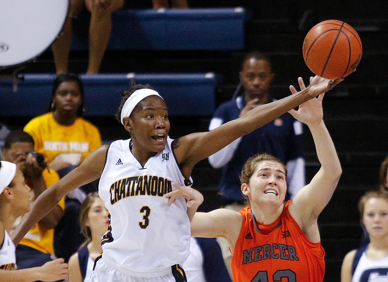 UTC forward Jasmine Joyner (3) rebounds the ball ahead of Mercer forward Madi Mitchell during the Mocs' SoCon basketball game against the Bears on Saturday, Jan. 31, 2015, at McKenzie Arena in Chattanooga.