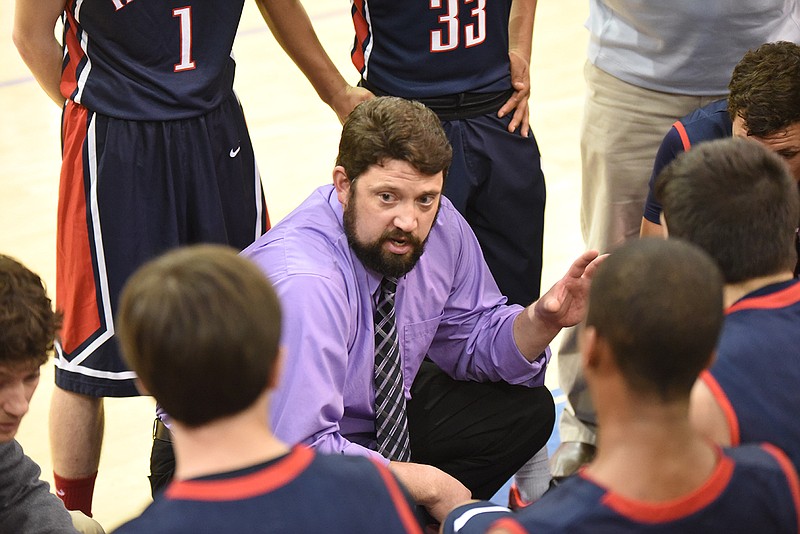 Heritage coach Kevin Terry talks to his players during a time out in a Region 7-AAAA basketball game Tuesday at Northwest Whitfield.