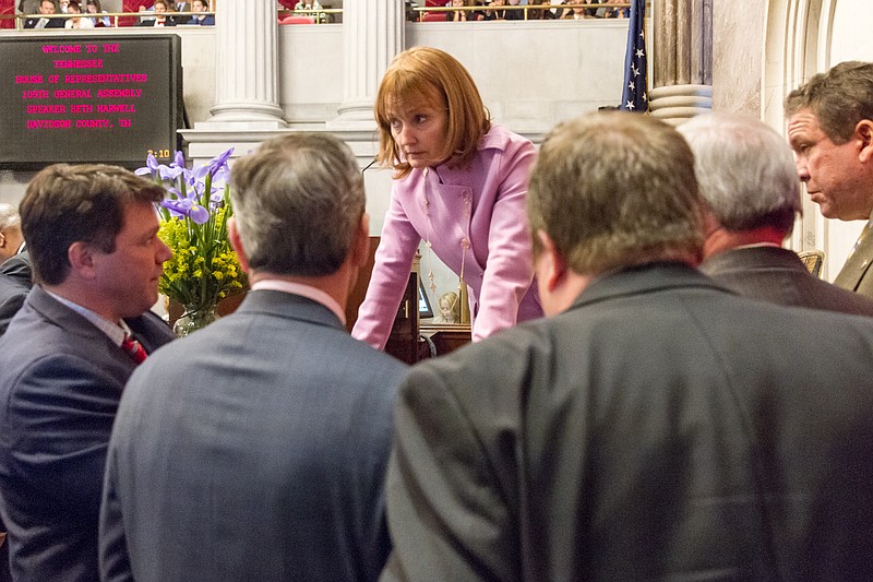 House Speaker Beth Harwell, R-Nashville, confers with colleagues and staff in the House chamber in Nashville on Feb. 4, 2015.