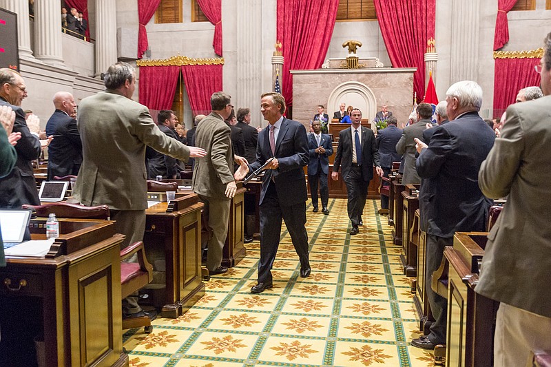 Republican Gov. Bill Haslam is greeted by lawmakers as he leeaves the House chamber in Nashville in this Feb. 2, 2015, file photo. 