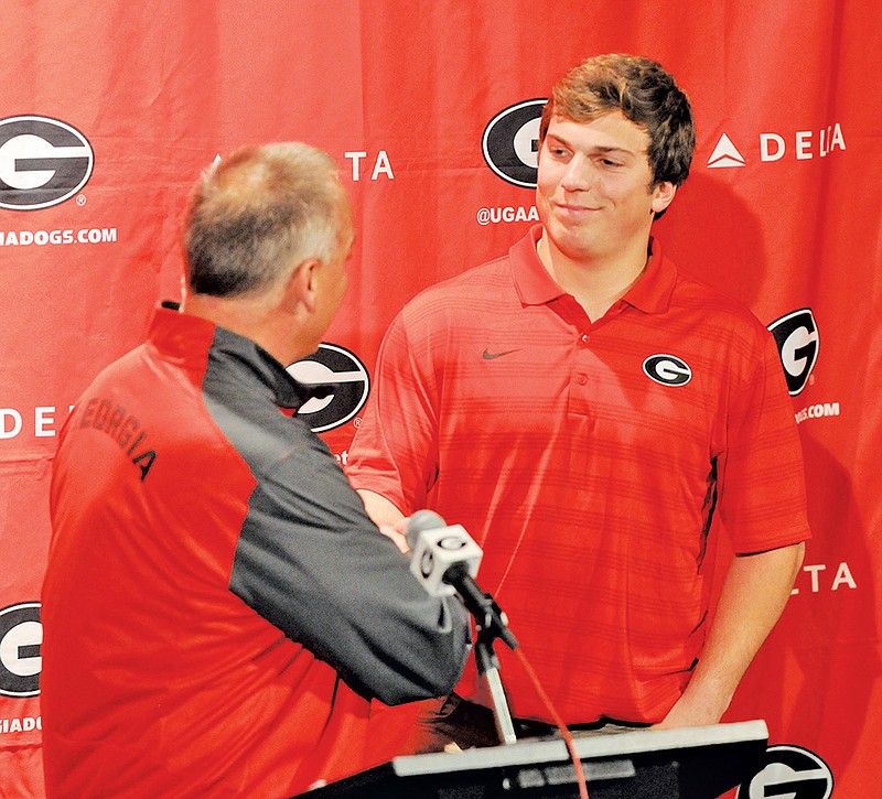 Jake Ganus shakes hands with Coach Mark Richt  during a signing day press conference on Wednesday, February 4, 2015 in Athens, Ga. (Photo by Sean Taylor, UGA)
