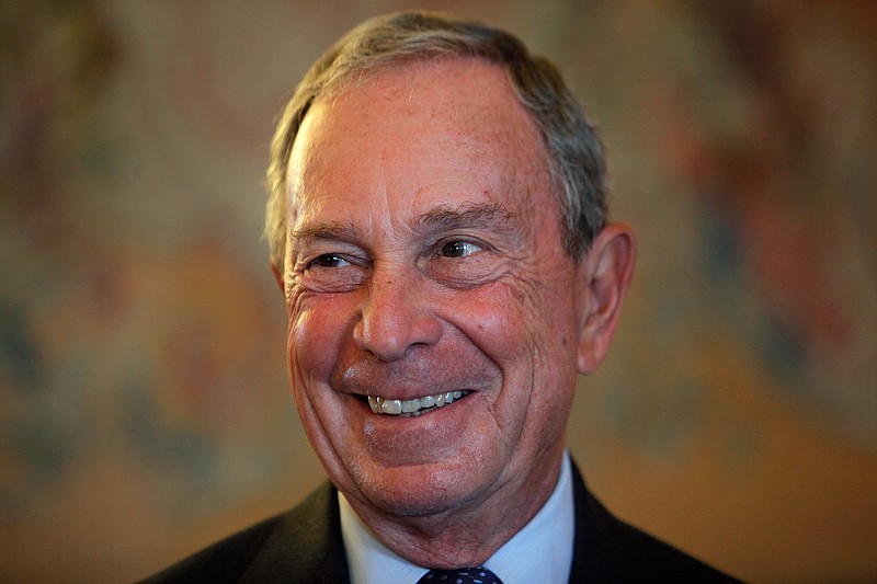 
              FILE - In this Sept. 16, 2014, file photo, former New York Mayor Michael Bloomberg smiles prior to be conferred with the Chevalier de la Legion d'Honneur by France's Foreign minister Laurent Fabius, at the Quai d'Orsay, in Paris. A Department of Investigation probe is finding that New York City’s effort to modernize its 911 system is years behind schedule and $700 million over budget. The probe released Friday, Feb. 6, 2015, lays the blame at the feet of the former mayor's administration. (AP Photo/Thibault Camus, File)
            