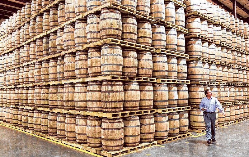 The popularity of Kentucky bourbon and Tennessee whiskey boosted sales for the second straight year. Some call it the "Mad Men" effect. Barrels of whiskey are stored in a warehouse at the George Dickel distillery near Tullahoma, Tenn.