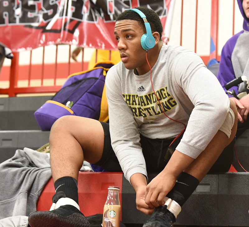 Central's heavyweight Sam Stephenson tapes his shoestrings before action in the 2-A/AA wrestling tournament at Signal Mountain High School on Friday, Feb. 6 2015.