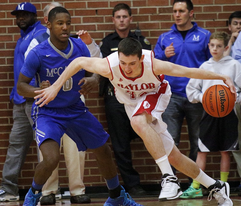 Baylor's Patrick Urey, right, breaks around McCallie's JaVaughn Craig during their rivalry basketball game Saturday, Feb. 7, 2015, at Baylor School in Chattanooga.