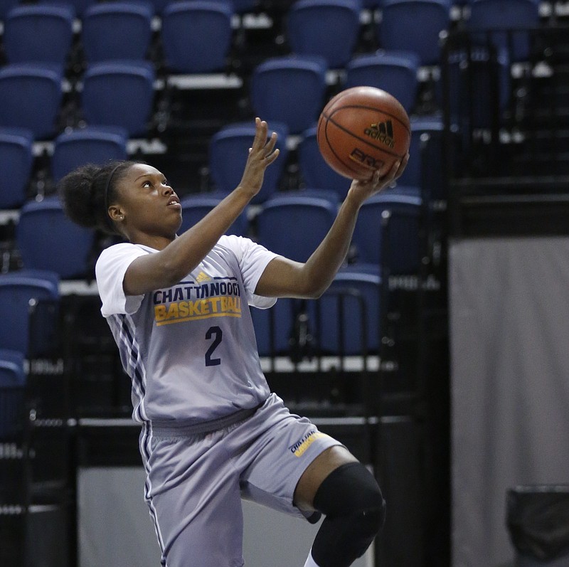 UTC forward Queen Alford lays the ball up during Lady Mocs' basketball practice in this Oct. 22, 2014, file photo.