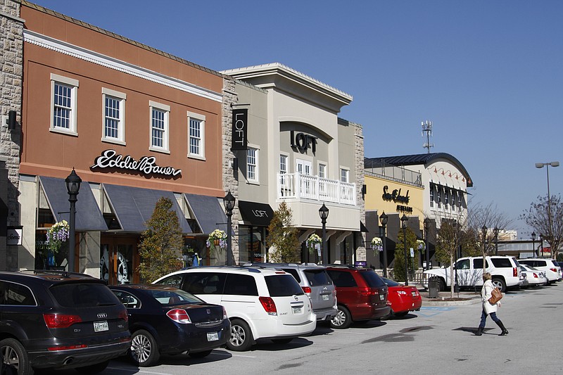 Shoppers visit the Hamilton Corner lifestyle center off of Gunbarrel Road