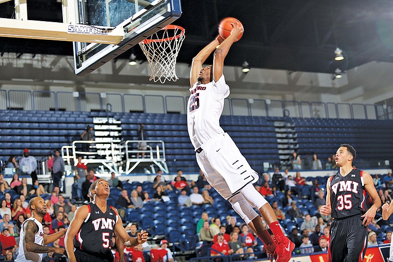 Samford's Michael Bradley from Tyner dunks impressively against VMI. He has been instrumental in the Bulldogs' five-game win streak.