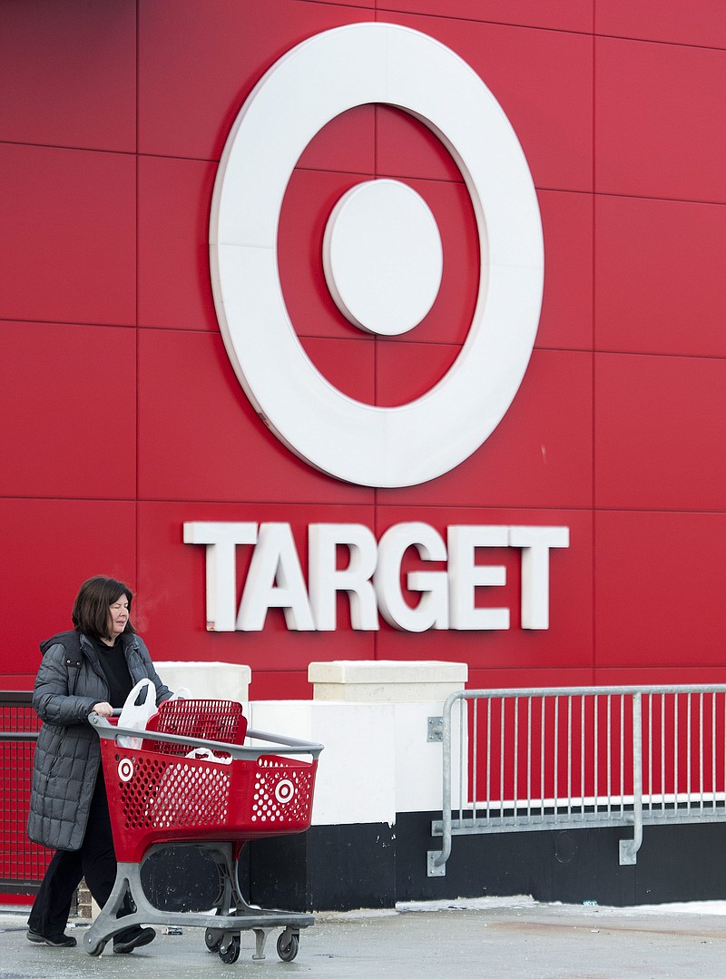 Shopper Laura Steele leaves a Target store in Toronto on Thursday, Jan. 15, 2015. 