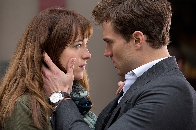 Jamie Dornan, left, and Dakota Johnson in a scene from "Fifty Shades of Grey."