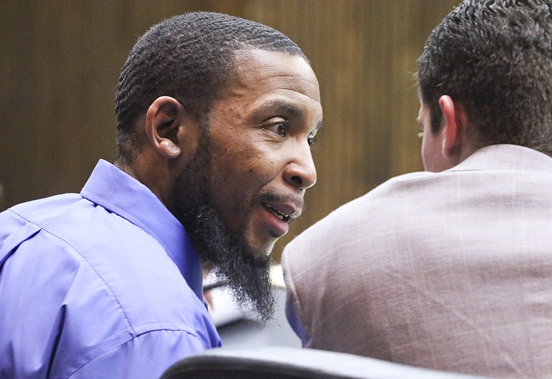 Stephen Mobley speaks to his defense attorney Zack Newman during his murder trial in Division 1 Criminal Court on Friday, February 13, 2015. Mobley is charged with murder and attempted murder in the 2012 shooting death of Gregory Watkins at a Brainerd gas station. 