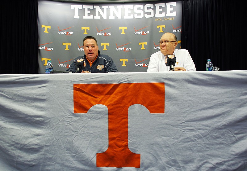 University of Tennessee NCAA college football head coach Butch Jones, left, speaks during a press conference introducing Mike Debord, right, as the new offensive coordinator on Feb. 13, 2015, in Knoxville.