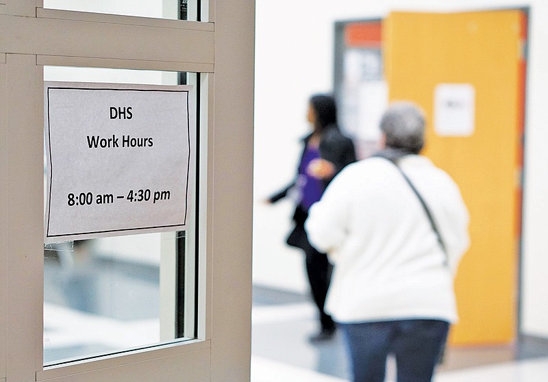 Visitors enter the State of Tennessee's Department of Children's Services office in the Eastgate complex on Thursday.