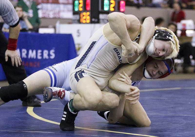 Bradley Central's Knox Fuller, top, wrestles Cleveland's Colton Landers in their TSSAA state wrestling championship 126 lb match on Saturday, Feb. 14, 2015, at the Williamson County Agricultural Expo in Franklin, Tenn.