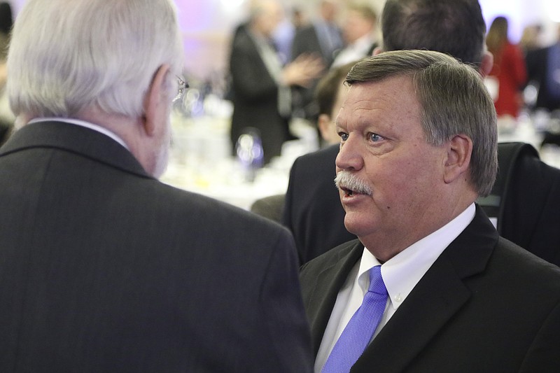 Hamilton County Mayor Jim Coppinger speaks to Robert Nodes at the conclusion of the annual Mayors Business Breakfast at the Chattanooga Convention Center on Jan. 14, 2015. 