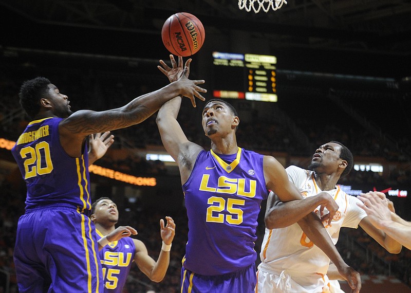 LSU forwards Brian Bridgewater (20) and Jordan Mickey (25) out-muscle Tennessee guard Kevin Punter (0) for a rebound during their game in Knoxville on Saturday, Feb. 14, 2015.